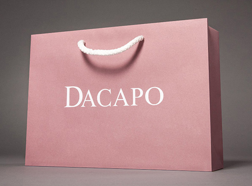 Environmentally friendly printed paper bag made from kraft paper, DACAPO logo