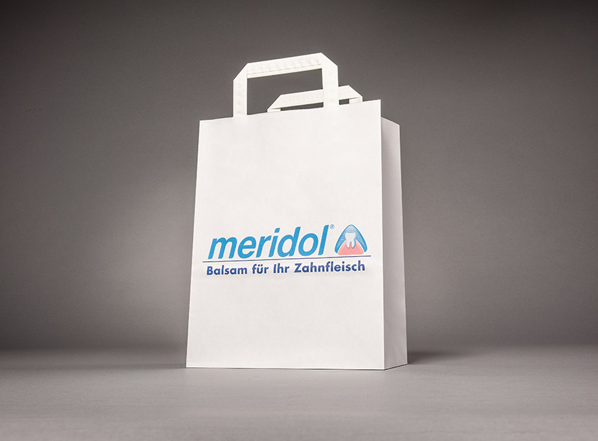 Printed paper bag with flat handle, Meridol motif