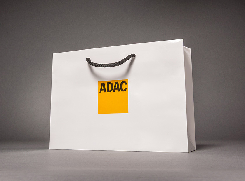 Printed paper carrier bag with detachable coupon, ADAC logo