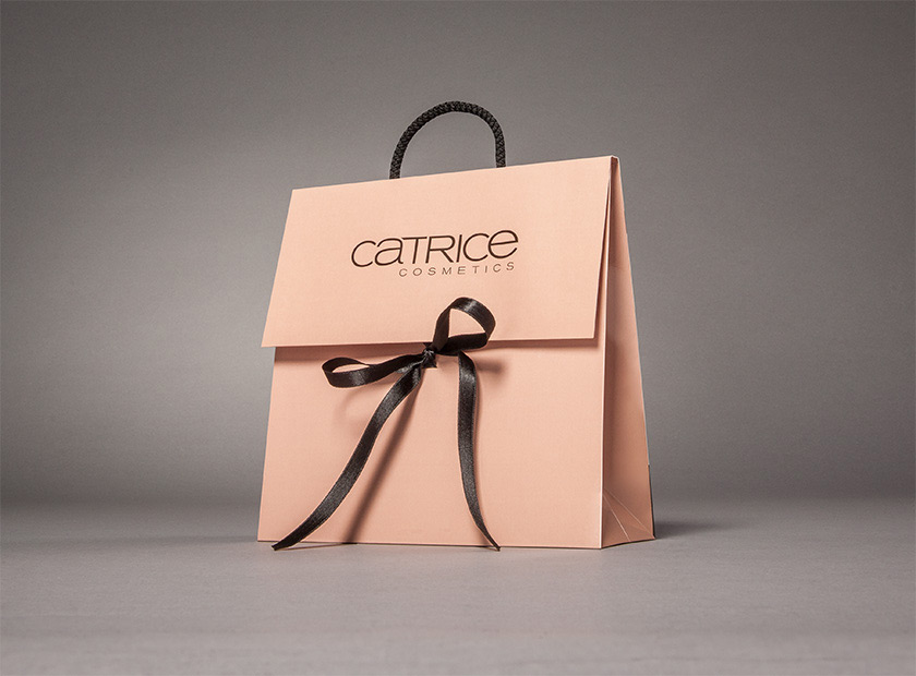 Paper gift bag with cover flap and bow, Catrice motif