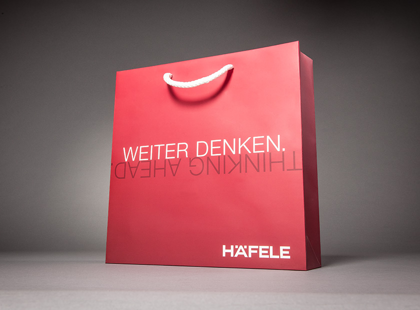 Printed paper bag with cord, Häfele logo